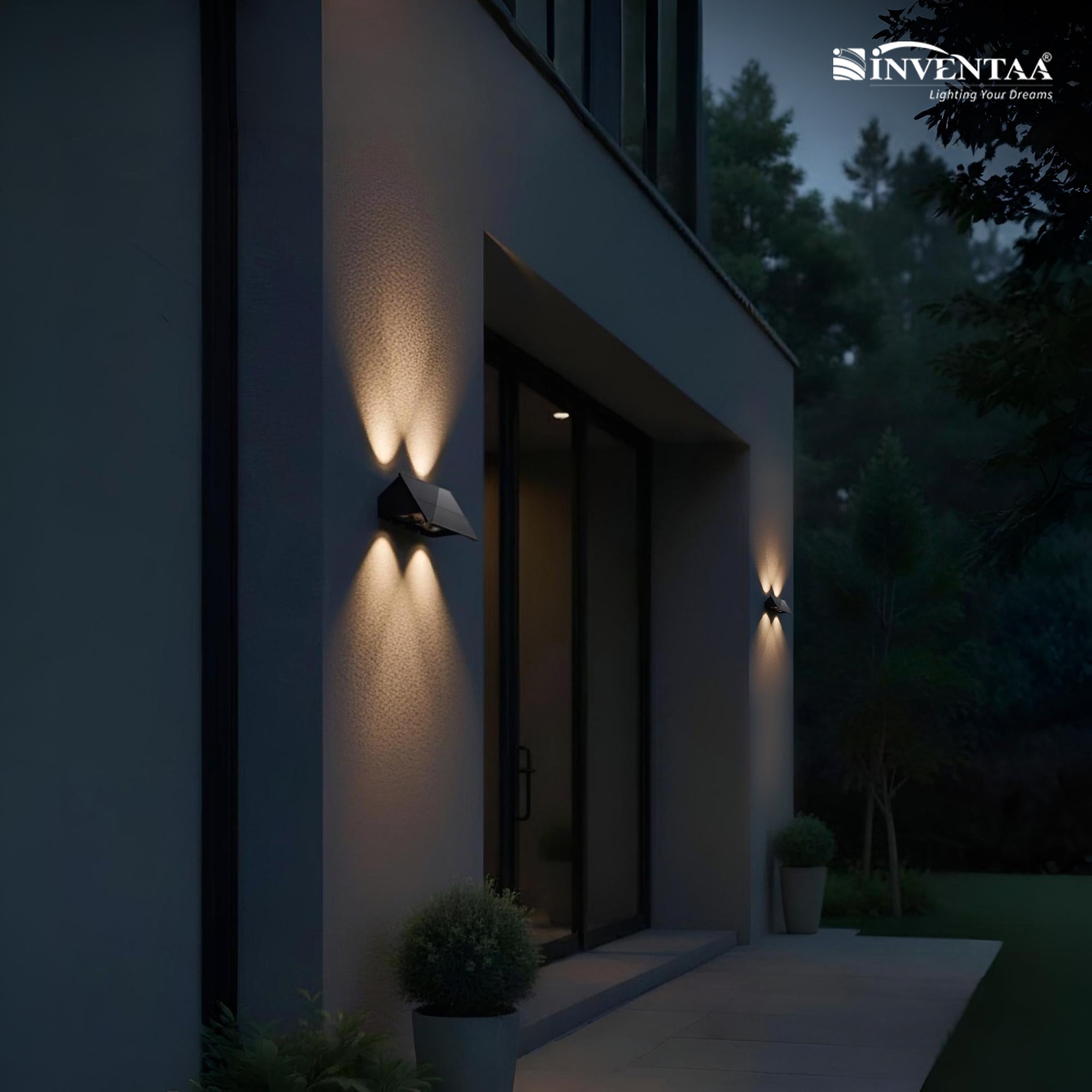 Modern house exterior with outdoor wall lights at night, featuring the Inventaa brand.